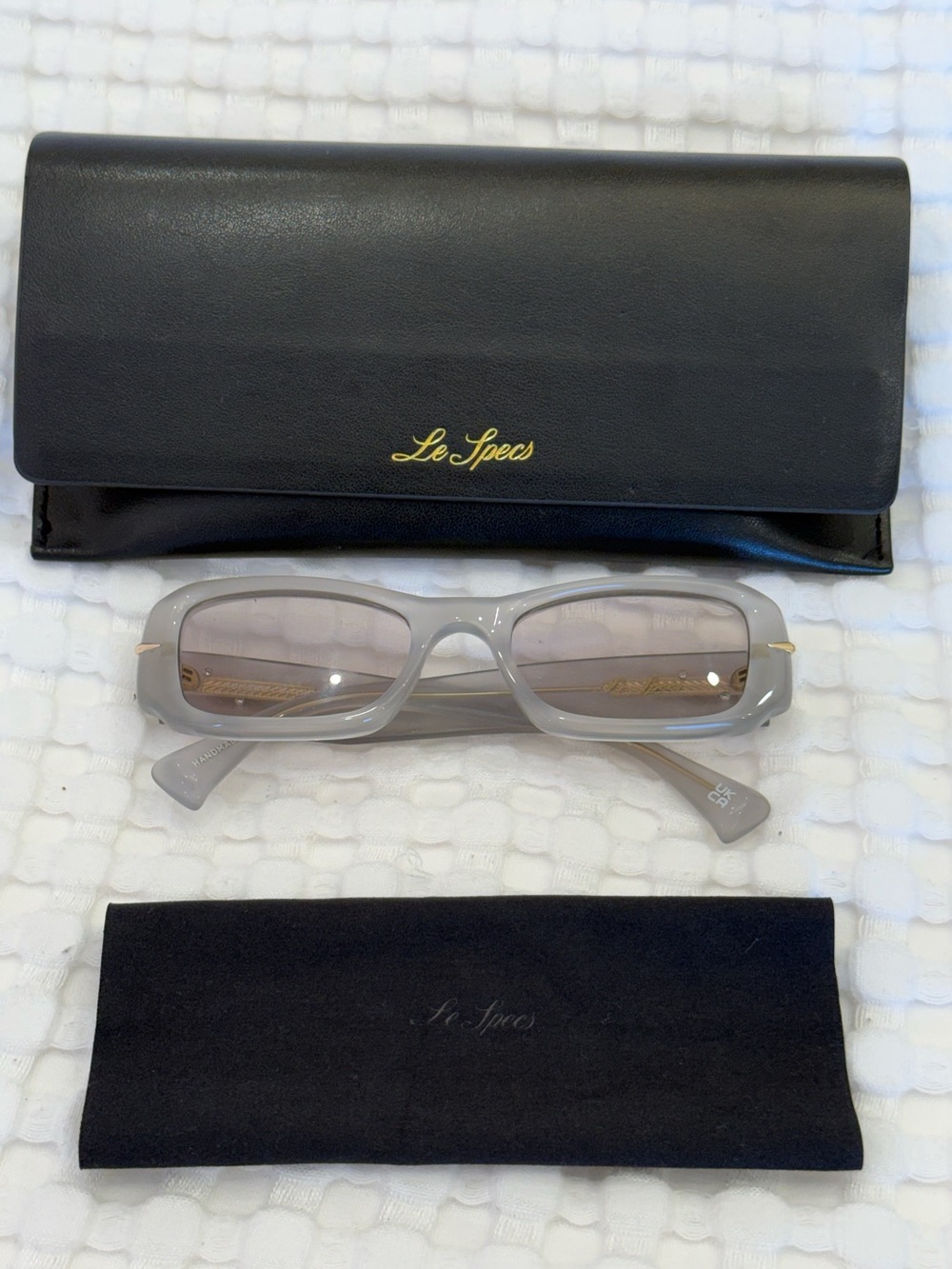 Le Specs Translucent Gray Rectangular Sunglasses with Gold Accents